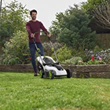 Man pushing the CLM50 cordless lawnmower