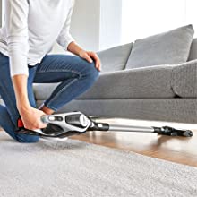 Cleaning under a sofa