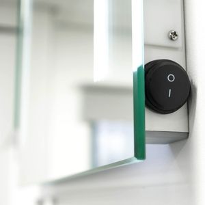 Rocker switch on the Gina LED Mirror