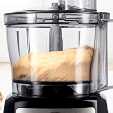 Shows close up of the transparent plastic bowl with lid including stuffer.