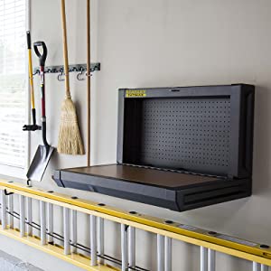 Folding workbench for wall mounting turns any garage into a workshop.