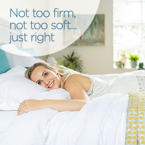 girl lying in bed smiling