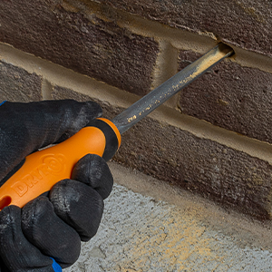 Clear the excess debris from the hole