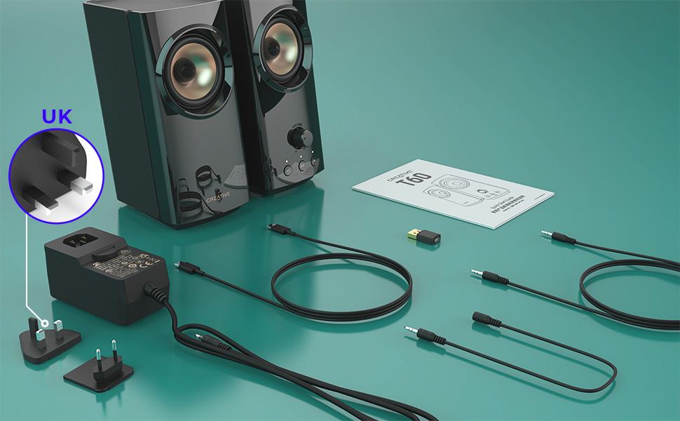 close up of creative t60 to show the buttons and volume knob