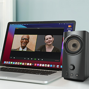 creative t60 sitting on a minimalist desktop beside a pc monitor