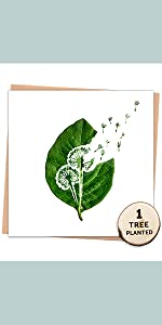 Recycled greeting card of leaf with dandelion carving and seeds blowing away. 1 Tree Planted disc on
