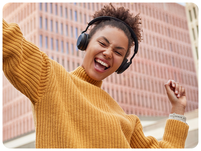 happy person listening to music in headphones after ear cleaning and ezcema treatment