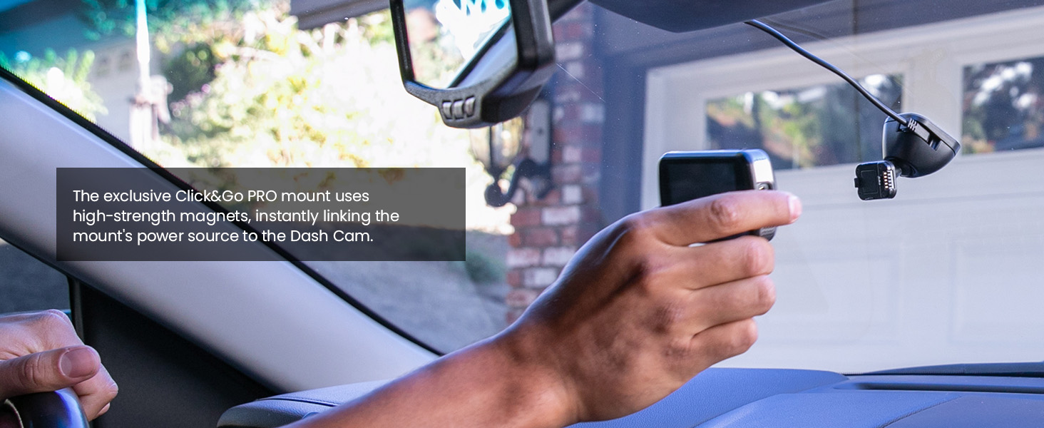 a hand holding a car mirror.