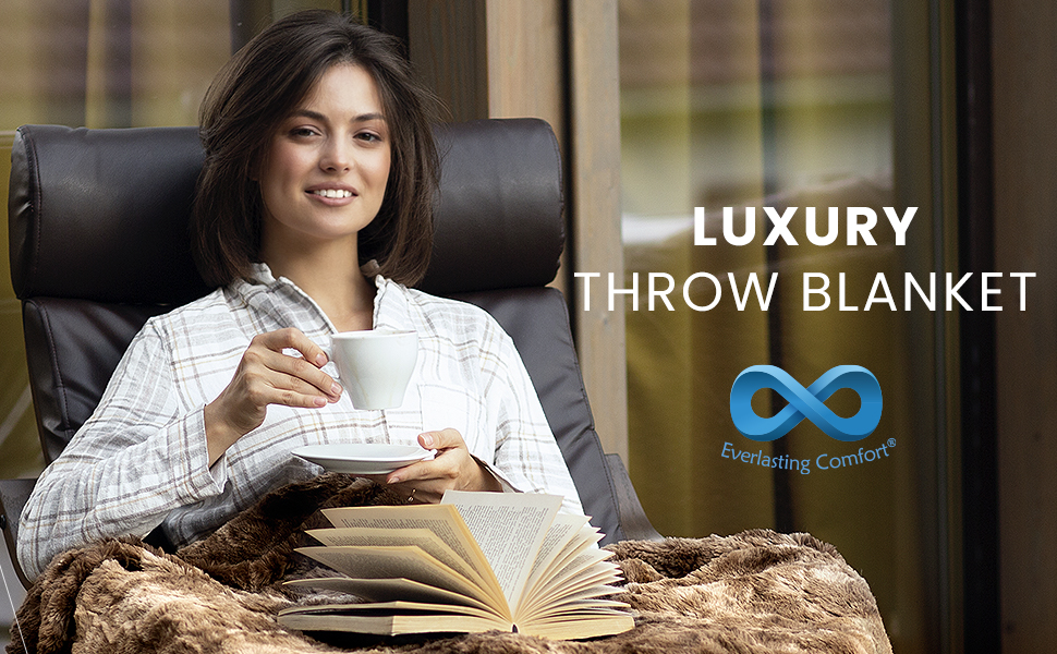 Woman in chair using the Everlasting Comfort Throw Blanket