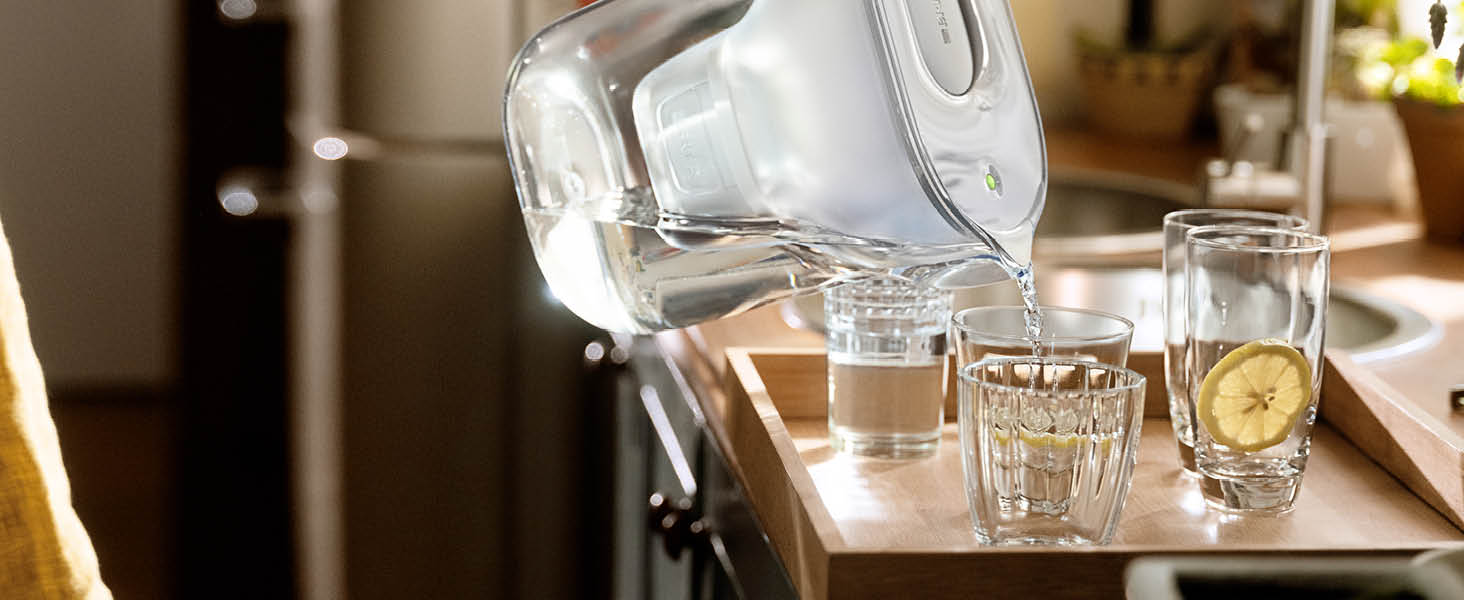 A BRITA Style Water Filter Jug filling up a glass with BRITA filtered tap water