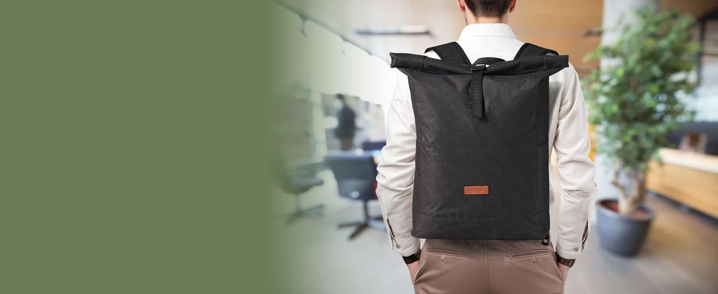 Backshot of someone walking through an office with roll top backpack on