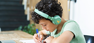 Boy studying with POGS