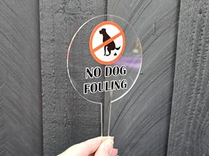 please keep off the grass sign