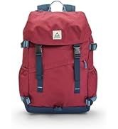 Woman wearing the Passenger Boondocker Camera bag in the forest putting a camera back in the bag