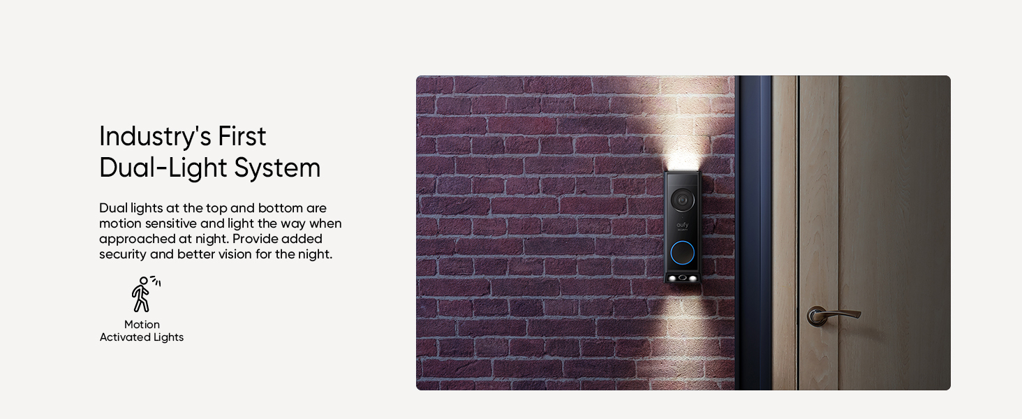 Outdoor wall light fixture with dual-light system, mounted on a brick wall next to a door. Provides both upward and downward illumination.