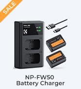 Text reads 'LP-E6NH Battery Charger'. Product image showing a black camera battery charger device with two battery units displayed alongside it.
