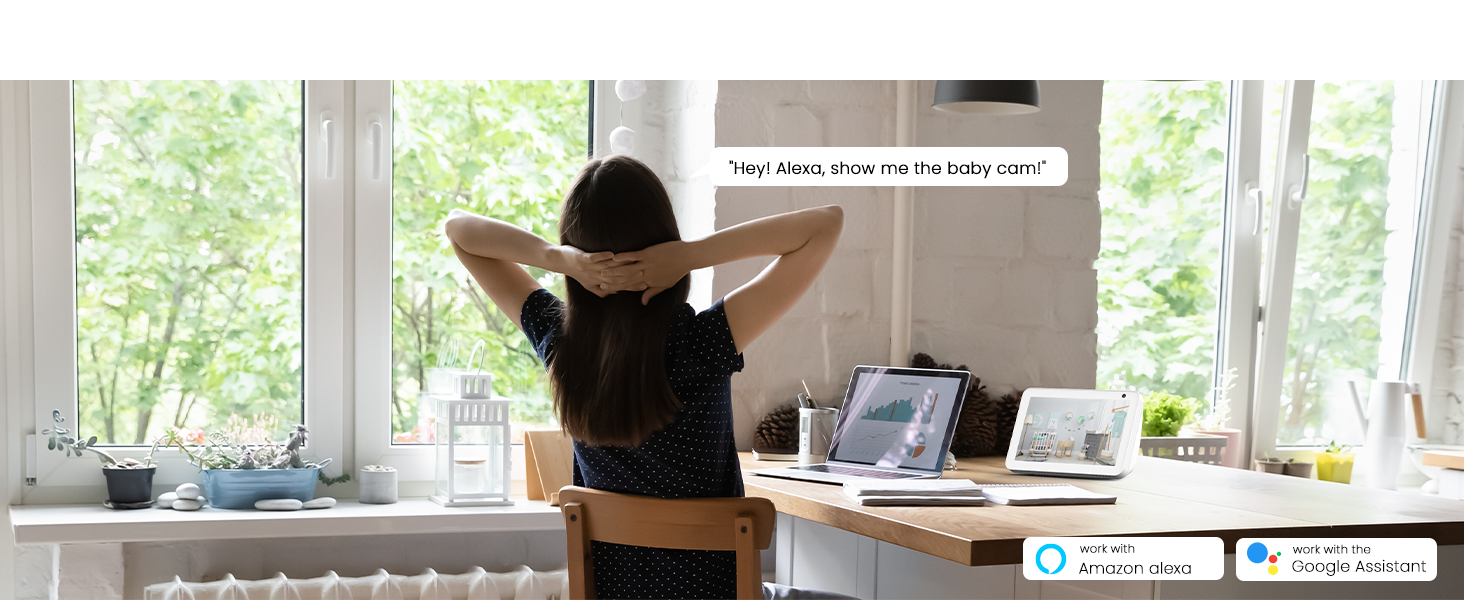 woman sitting at a desk with her hands behind her head