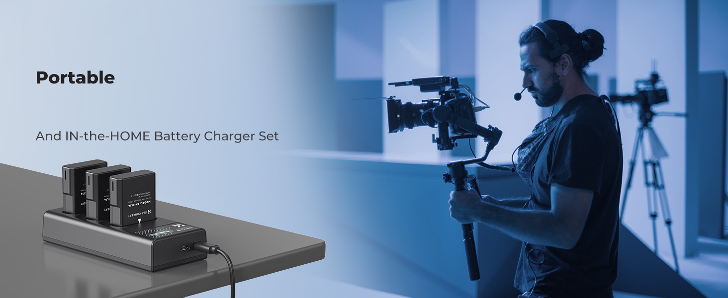 Multi-battery charging station on desk, with person using camera stabilizer equipment in background.