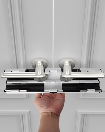 Close-up of a sliding door lock mechanism. White horizontal bar locks into place between two dark vertical brackets.