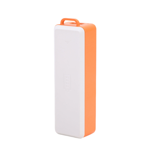 White rectangular portable power bank with orange accent strip and USB charging cable included.