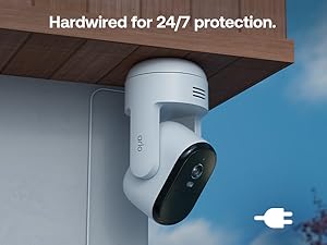 Text reads 'Hardwired for 24/7 protection.' White dome-shaped security camera mounted on ceiling or wall with power cord visible.
