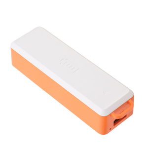 White rectangular portable power bank with orange accent strip and USB charging cable included.