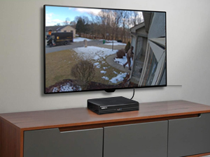 a video camera on a tv stand.