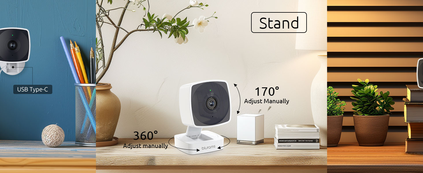 Compact security camera with stand. Features 360° rotation and 170° tilt. USB-powered, shown on desk with office accessories.