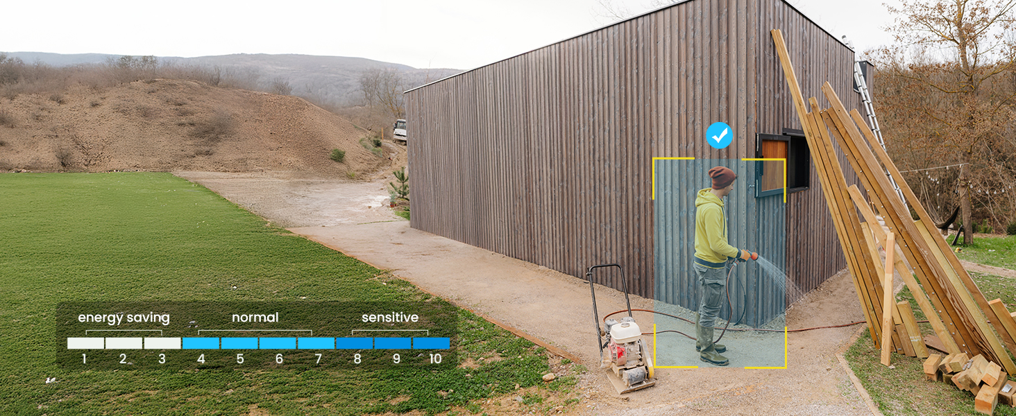 Modern wooden architectural structure with slide feature built into hillside. Natural landscape setting with grass and walking path.