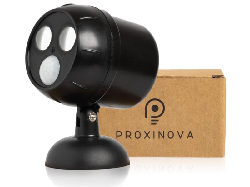 Black cylindrical device with three white circular lights, mounted on stand. Proxinova branded box visible beside the device.