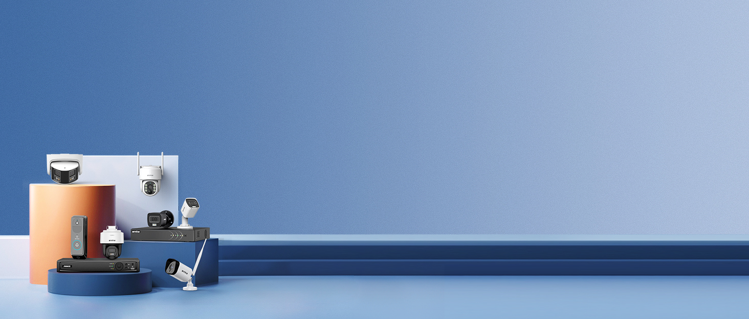 Collection of smart home devices on blue background, including security camera, thermostat, doorbell, and sensors. Devices arranged on geometric shapes with long blue surface extending to the right.