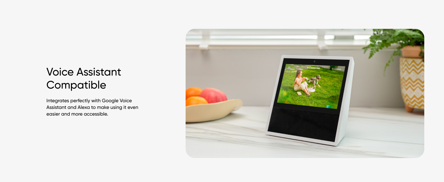 a tablet sitting on a table next to a bowl of fruit.
