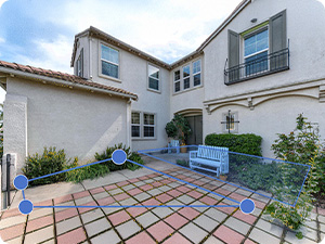 Aerial and ground-level views of residential properties with solar panels installed on red-tiled roofs.