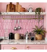 Modern bathroom interior with marble-look tiles in varying gray tones arranged in stacked pattern. Clean, minimalist design with contemporary fixtures against textured wall backdrop.