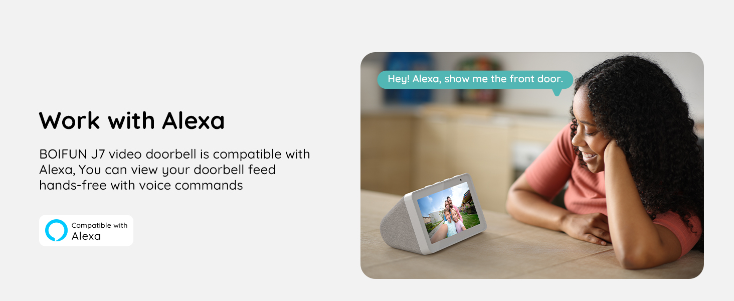 Smart display device on wooden surface, showing outdoor scene. Text indicates compatibility with Alexa for hands-free voice control of video doorbell functionality.