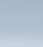 Close-up of a gray metal office desk drawer, partially open, showing the drawer's edge and interior.