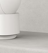 Minimalist white cylindrical ceramic or porcelain vessel with stepped base against light gray textured background.