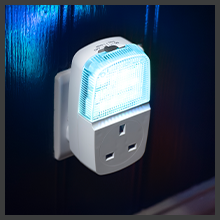 Two white electronic devices with digital displays showing settings or controls. Devices appear to be smart home or control system interfaces with modern minimalist design.