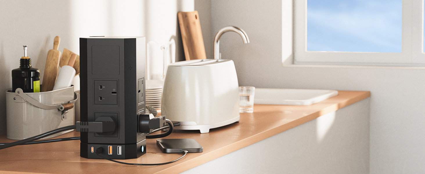 White toaster and speakers on wooden kitchen counter near window, showing modern kitchen appliance setup.