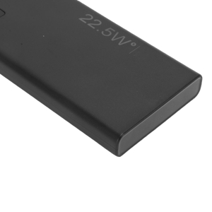 Black rectangular electronic device shown from multiple angles, displaying a sleek, minimalist design with matte finish.