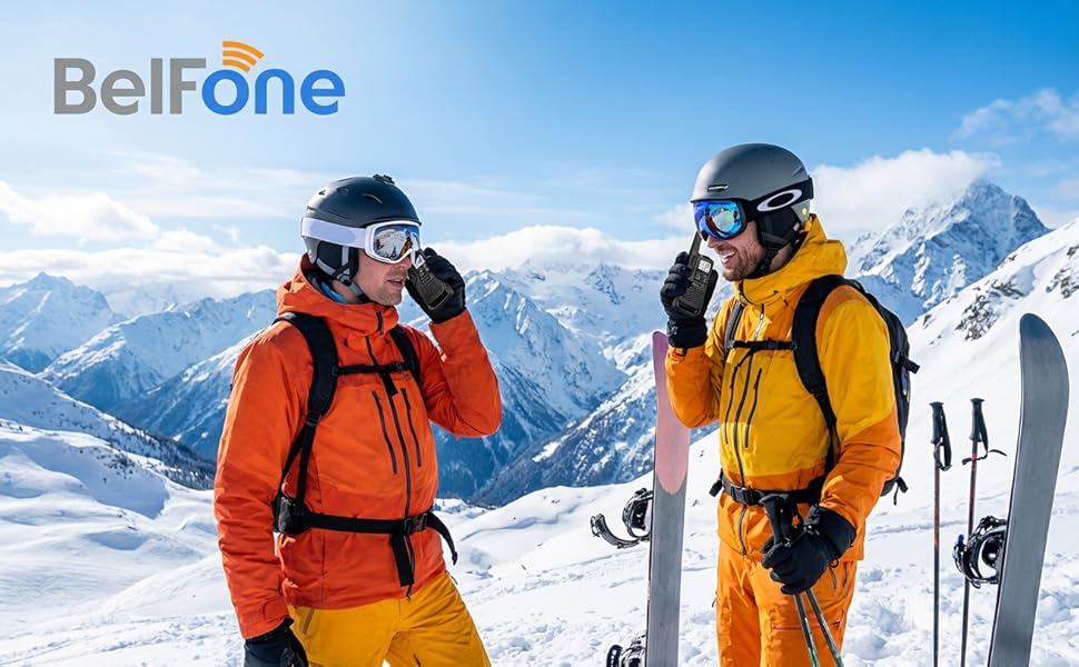 Text reads 'Belfone'. Group of skiers in bright orange and yellow safety gear on snowy mountain slope, demonstrating communication equipment use.