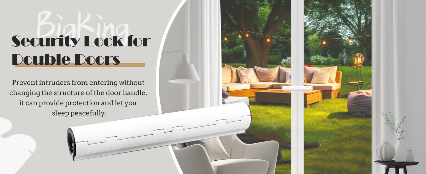 a white sofa with a white chair in front of a window with lights hanging from it.