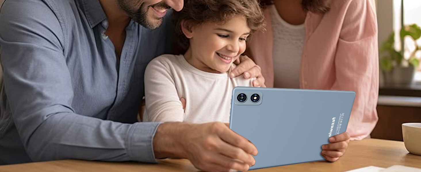 Light blue tablet device with dual rear cameras, held by hands. Child smiling while viewing the screen, with adults on either side.