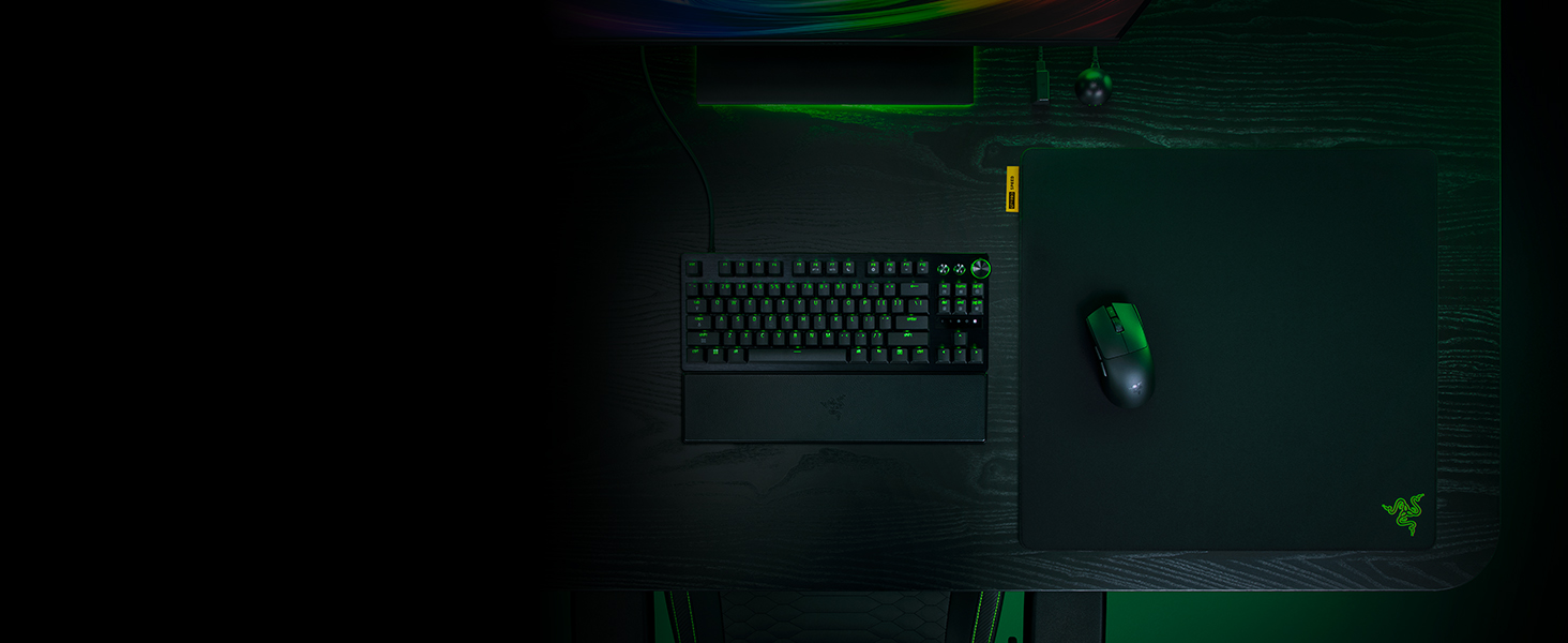 Dark gaming or tech interface screen with green accent lighting and minimal interface elements visible against black background.