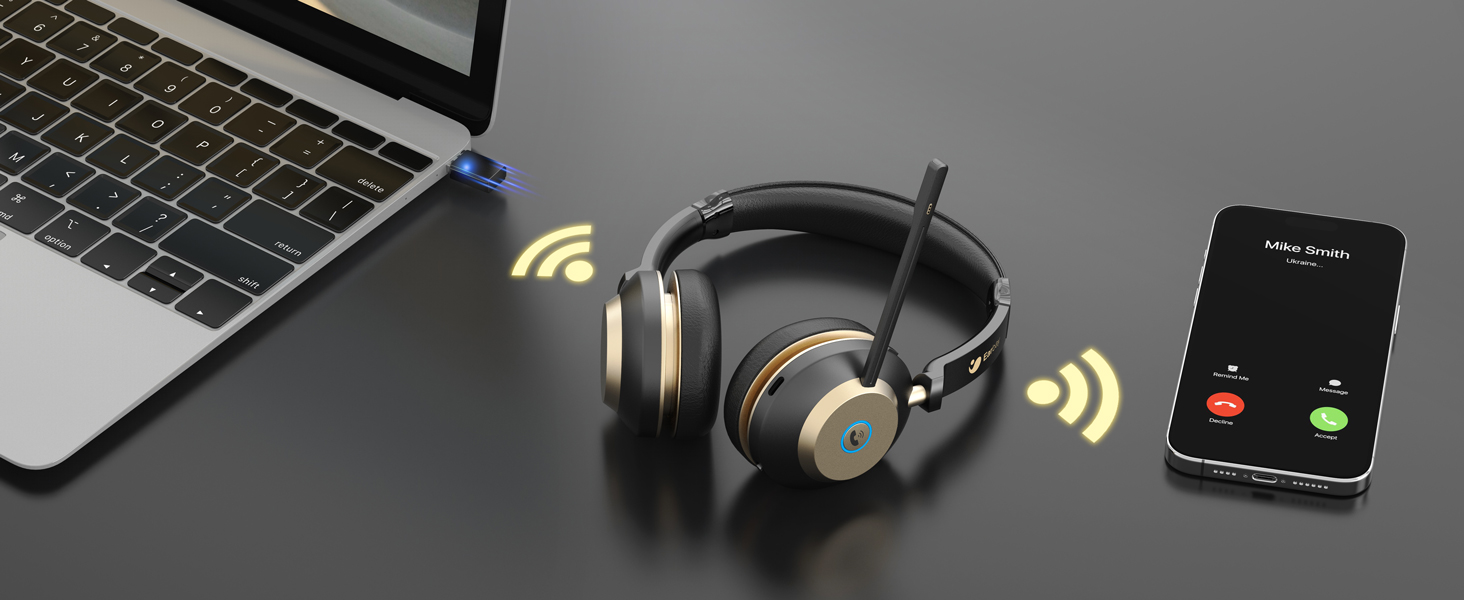 Tech setup showing wireless headphones with gold accents next to laptop and mobile phone displaying incoming call interface. Yellow wireless indicators shown.
