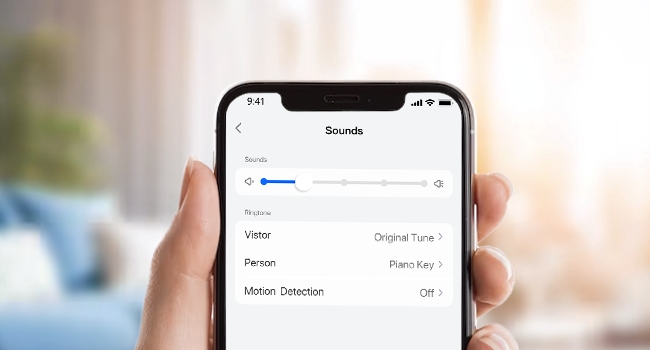 Wall-mounted wireless doorbell interface showing three feature icons: volume level, 5 levels adjustment, and 10 ringtone options.