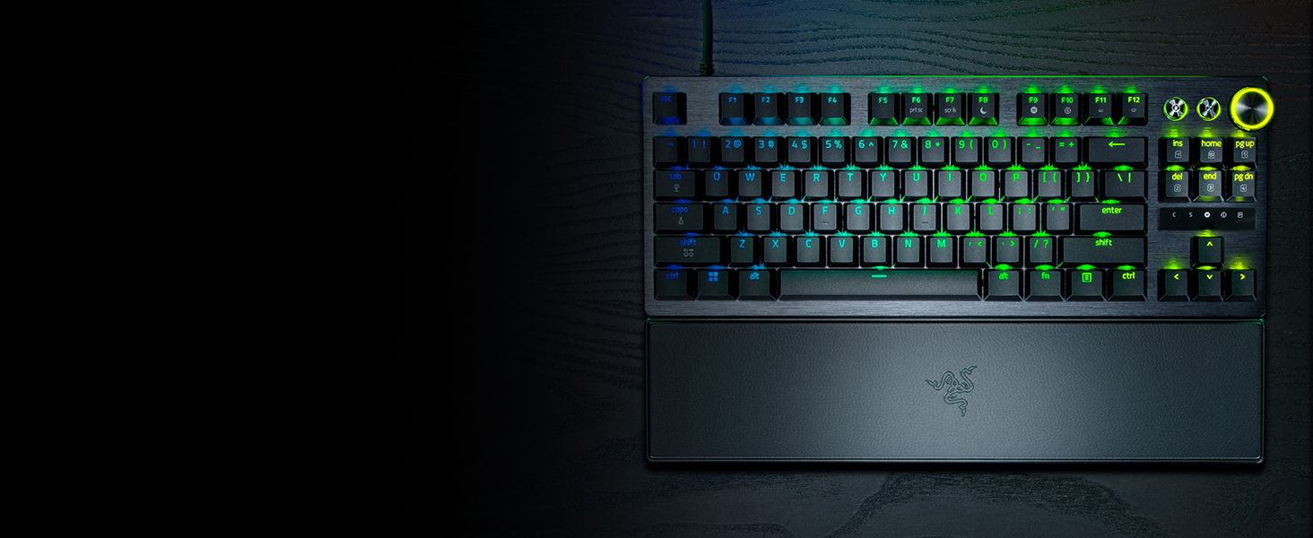 Gaming keyboard with RGB backlit keys displayed in multiple angles, showing mechanical switches and customizable lighting effects against dark background.
