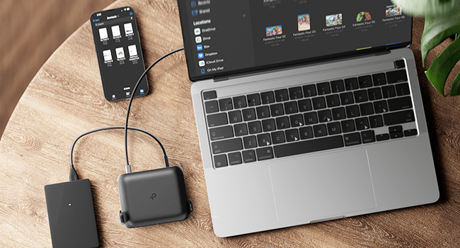 Multiple views of a small black electronic device connected to different laptops, showing various connection and mounting positions on laptop screens.