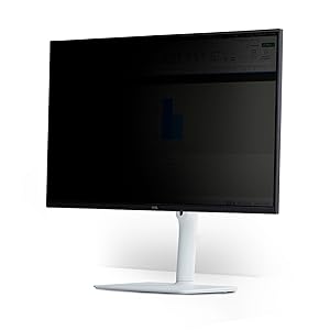 Computer monitor displaying privacy screen filter that darkens display when viewed from side angles.