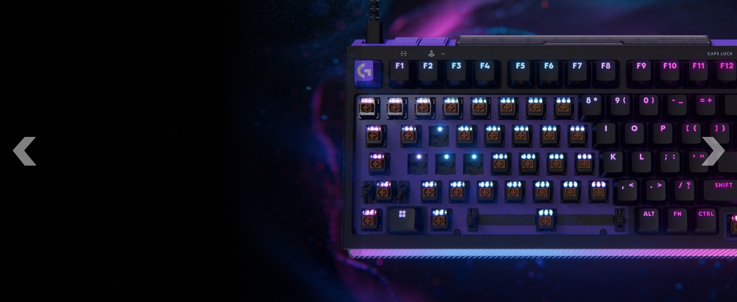 Close-up of a mechanical gaming keyboard with purple/blue LED backlighting illuminating the keys against a dark background.